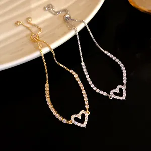 Detailed view of elegant zircon heart adjustable bolo bracelets in gold and silver