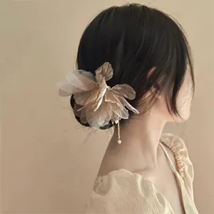 Elegant butterfly flower hairpin with pearl tassel for ethereal bun hairstyle