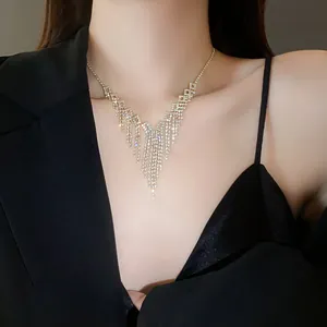 Close-up of elegant V-shaped rhinestone fringe necklace showing sparkling jewelry detail