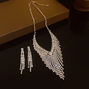 Detail view of sparkly silver-toned rhinestone fringe necklace and earrings set