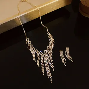 Elegant gold-toned rhinestone fringe necklace and matching earrings jewelry set for women