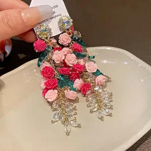 Elegant heavy industry crystal tassel earrings featuring pink resin roses and silver needles