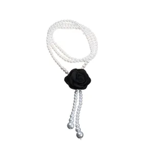 Vintage long pearl necklace with elegant black fabric rose pendant and tassels charm