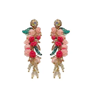Handmade crystal floral tassel drop earrings with red resin roses and sparkling rhinestones