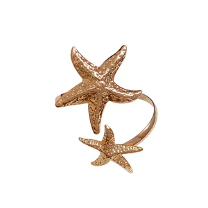 Elegant rose gold metal starfish open cuff bracelet with textured sea star design