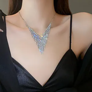 Sparkling V-shaped rhinestone fringe necklace shown on model for elegant styling