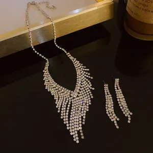 Elegant silver-tone rhinestone fringe necklace and earrings set for formal occasions