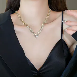 Close-up view of a V-shaped rhinestone necklace showing sparkling crystal detail