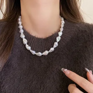 Elegant irregular baroque pearl choker necklace for women, minimalist French style jewelry.