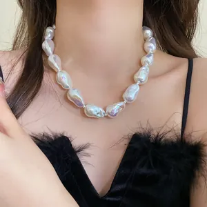 Detailed view of a French style irregular baroque pearl necklace with glossy finish