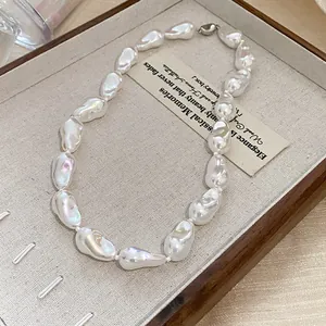 High-quality detailed close-up of irregular baroque pearl necklace with elegant iridescent luster