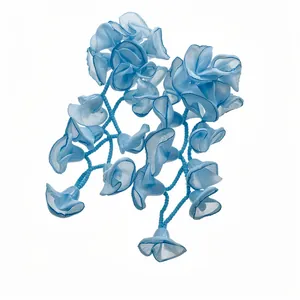 Handmade light blue chiffon flower tassel earrings with delicate blue beads on white background