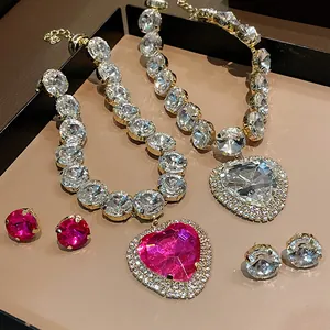 Close-up detail of luxury heart-shaped rhinestone necklace and matching stud earrings set