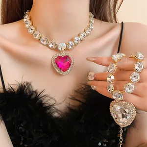 Detail view of a luxury heavy-duty heart rhinestone necklace and bracelet set on a model