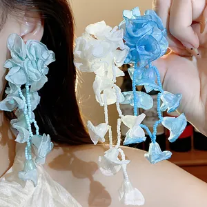 Detail showing texture of blue and white chiffon flower tassel earrings