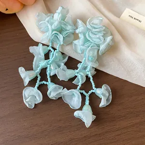 Light blue chiffon flower tassel earrings with silver needles for a sweet vacation look