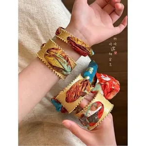 Ethnic style exaggerated gold acrylic bangle bracelets with colorful fabric wraps