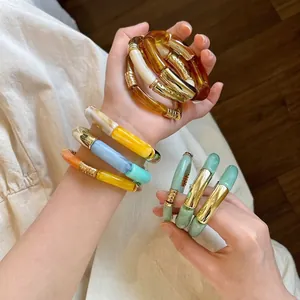 Multi-colored chunky acrylic bamboo bangles with elegant gold metal accents for women