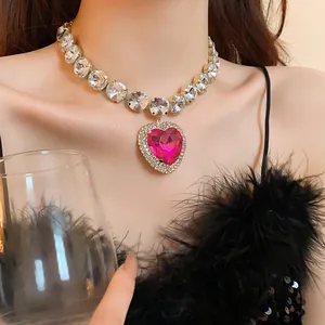 Detailed macro view of heart-shaped pink crystal necklace with luxury rhinestone chain