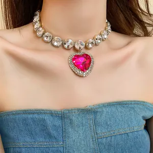 Detail view of heavy-duty pink heart crystal necklace with clear rhinestone accents