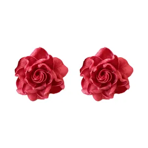 Elegant red resin rose flower stud earrings with a vintage and romantic aesthetic