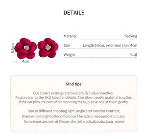 Detail view showing red flocked flower earrings with dimensions and material specs
