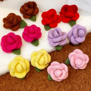 Close-up detail of colorful flocked flower stud earrings available in various sweet colors