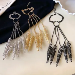 Hollow floral pattern nail claw bracelet with tassel chains in gold silver black colors