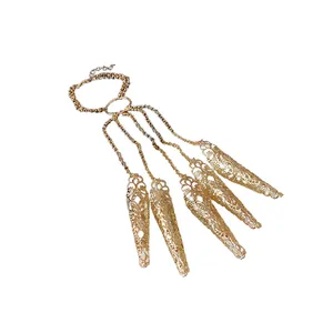 Exquisite golden hollow pattern finger claw bracelet with intricate tassel chain detail