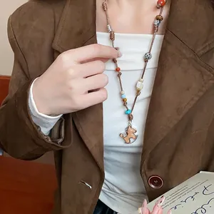 Handmade woven rocking horse necklace with colorful beads for autumn winter fashion