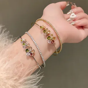 Close-up of double-layer zircon flower bracelet and tennis chain worn on a wrist