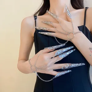 Exquisite gothic hollowed-out silver nail covers connected to a delicate chain bracelet
