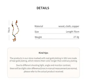 Detail view of rocking horse sweater necklace with material and size specifications.