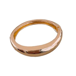 Elegant minimalist rose gold open bangle bracelet with a smooth polished finish