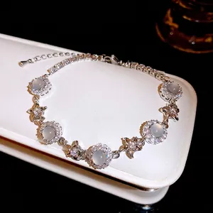 Elegant luxury zircon and chalcedony flower bracelet showcased on a white display stand