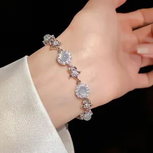 Elegant detail view of a zircon floral bracelet featuring chalcedony stones on a wrist