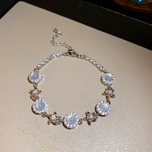 Detailed view of a silver-toned bracelet with chalcedony and sparkling zircon stones