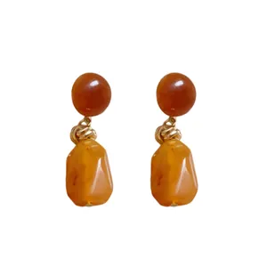 Irregular amber resin earrings in vintage Maillard style with elegant gold knots