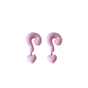 Trendy pink resin question mark earrings with heart charms for women on white background