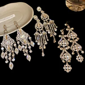 Detailed view of luxury rhinestone chandelier earrings with elegant silver fringe
