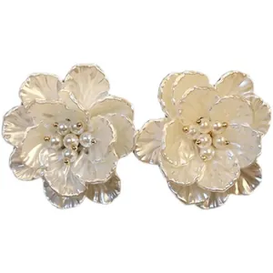 Elegant vintage French design white floral stud earrings with pearl centers for women.