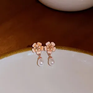 Elegant pink enamel flower earrings with sparkling rhinestones and white pearl drops
