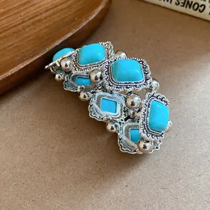 Close-up detail of bohemian vintage elastic bracelet with turquoise acrylic stones