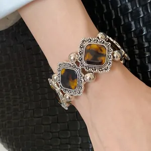 Close-up of vintage bohemian acrylic stretch bracelet with tortoiseshell pattern detail