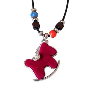 Charming red flocked rocking horse pendant necklace with zircon and vibrant beads