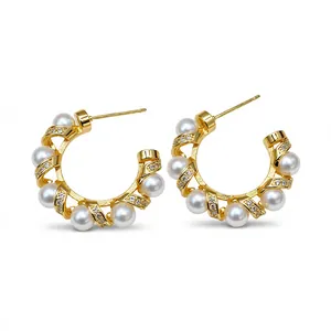 Elegant 18k gold plated C-shaped hoop earrings featuring white pearls and zircon