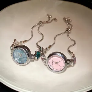 Elegant vintage-style metal bracelet watch with star charms and an adjustable pull-bead chain