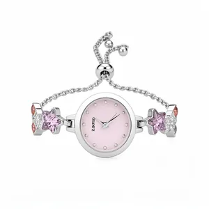 Elegant silver star bracelet watch with light pink dial and adjustable bolo chain.