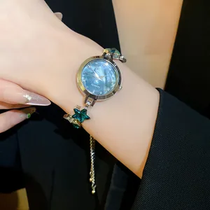 Detailed close-up of a luxury vintage star-shaped crystal bracelet watch for women