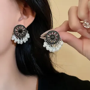 Elegant vintage ethnic style tassel earrings with white pearls and black rhinestones